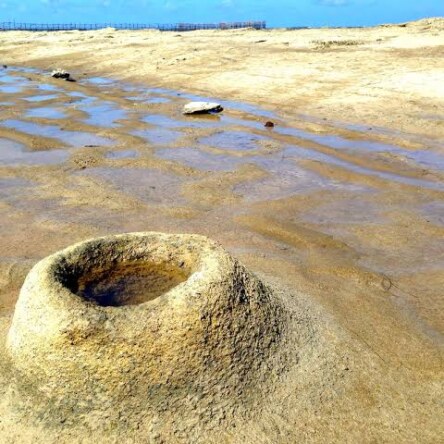 How are sand volcanos are formed?